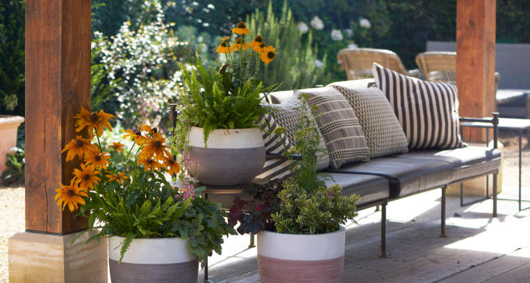 Mixing Clay Planters With Metal Sculptures