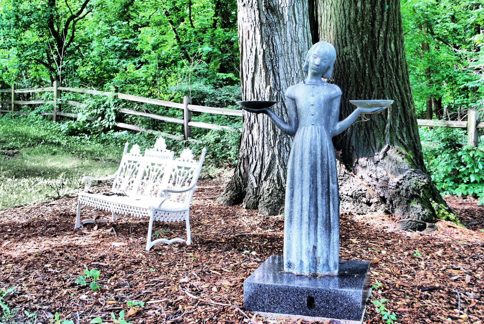 Female statue holding trays in a Savannah cemetery
