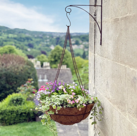 Outdoor wall decor with hanging baskets
