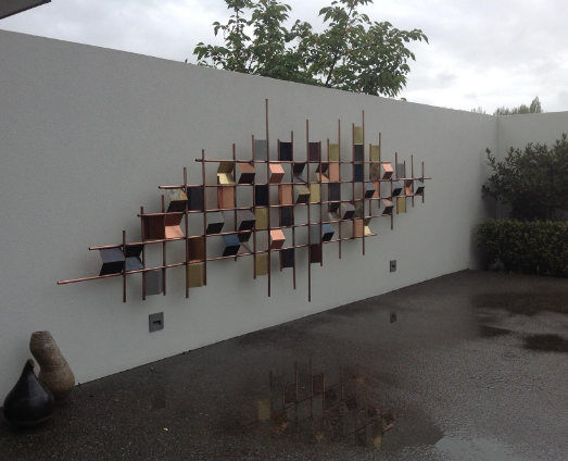 Outdoor wall decor with sculptural elements