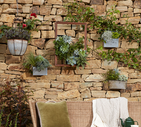 Outdoor wall decor for themed gardens